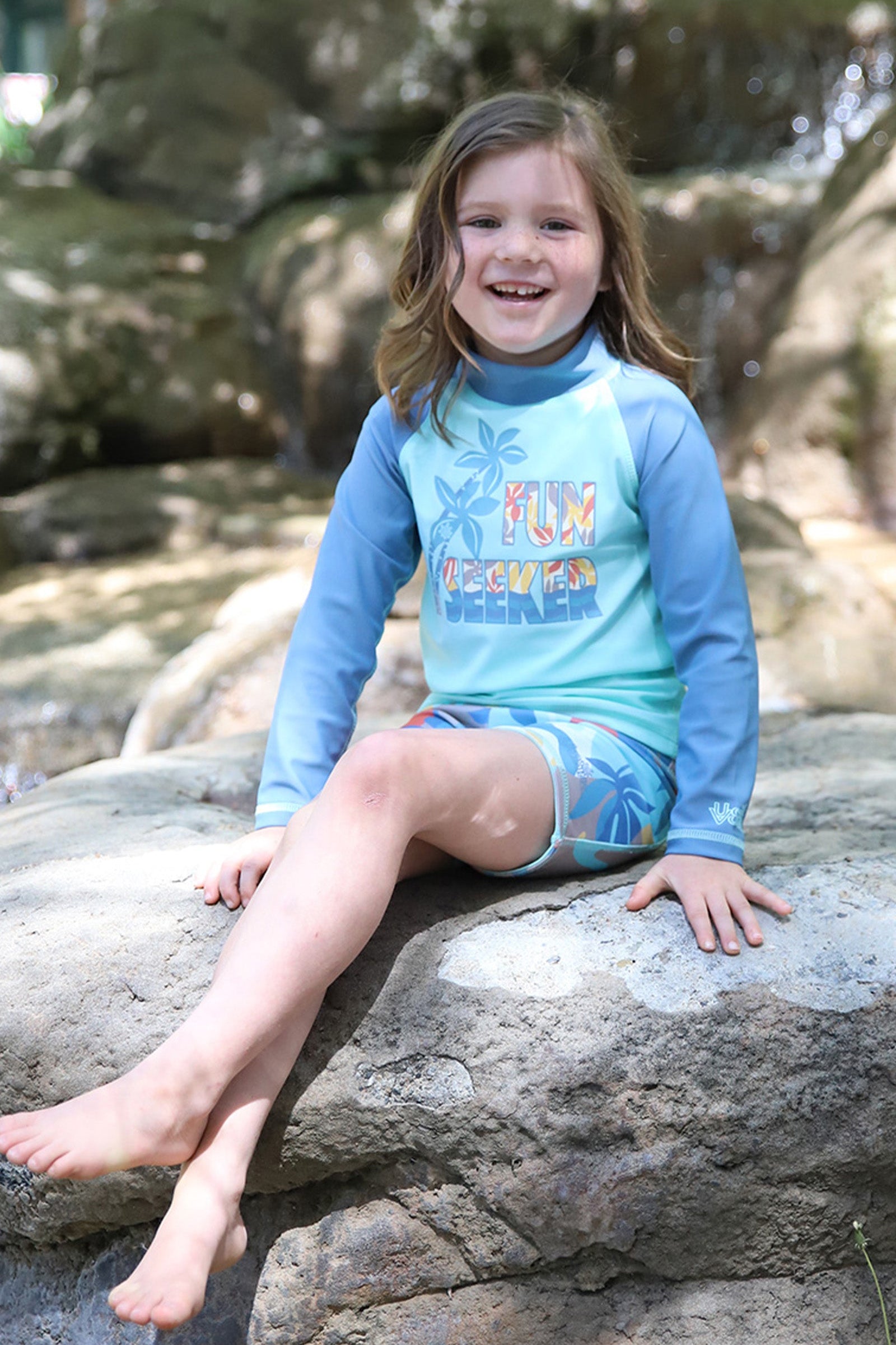 girl on rock in kids long sleeve sun & Swim shirt|fun-seeker