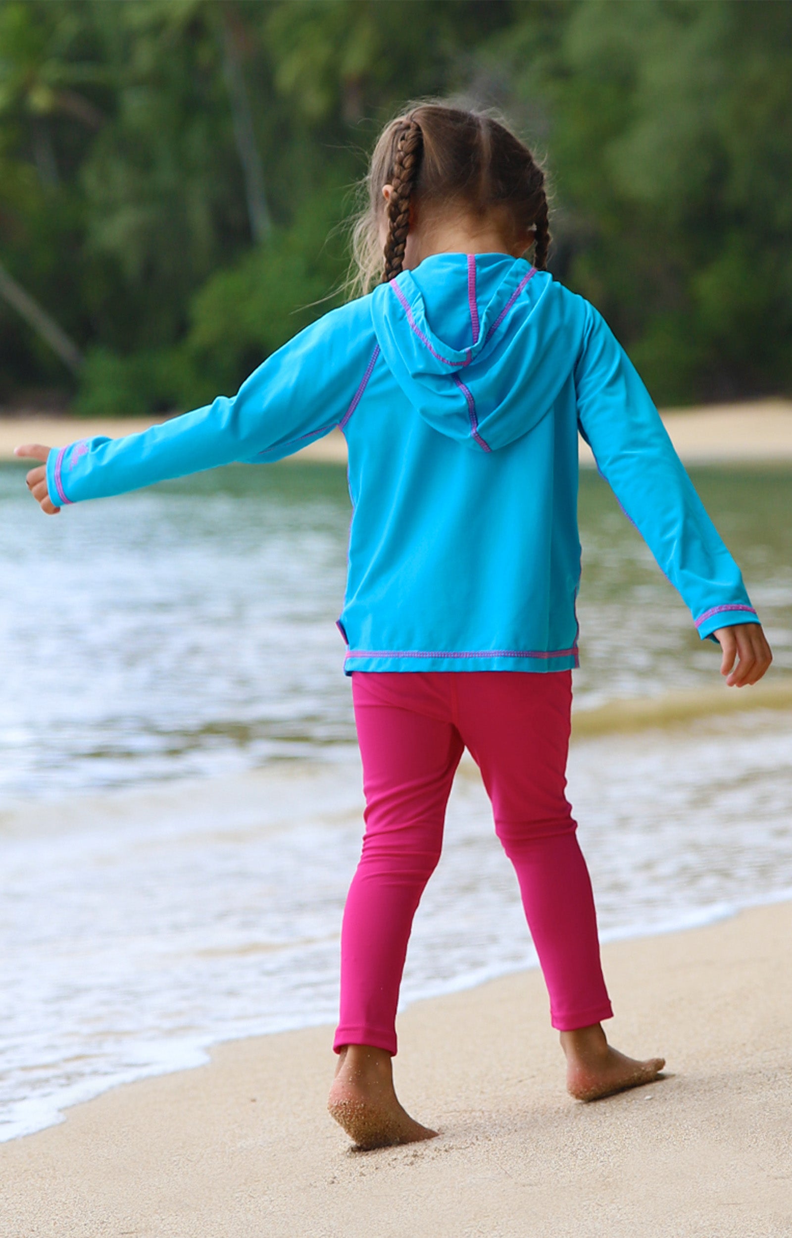 Little girl in UV Skinz's girls pullover hoodie in aqua|aqua