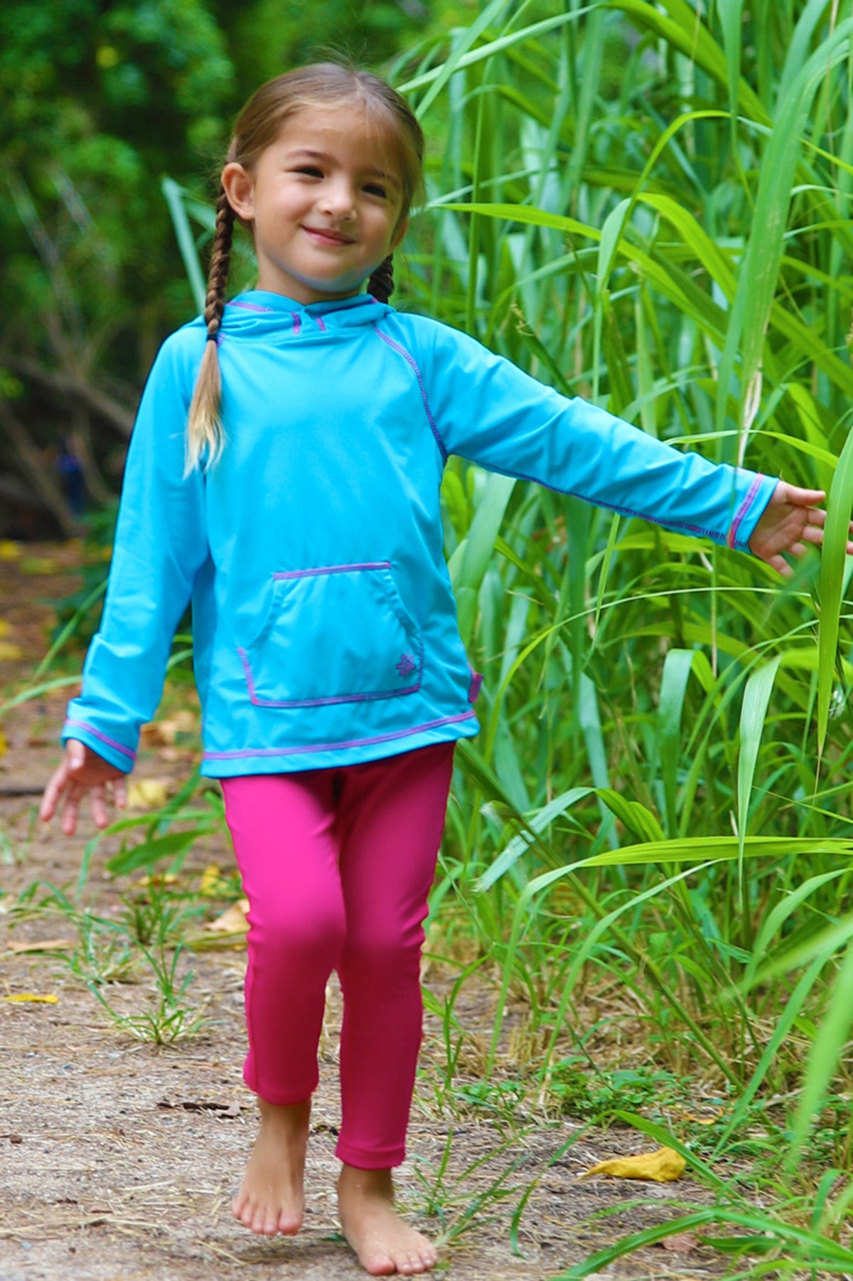 Little girl in UV Skinz's girl's pullover hoodie in aqua|aqua