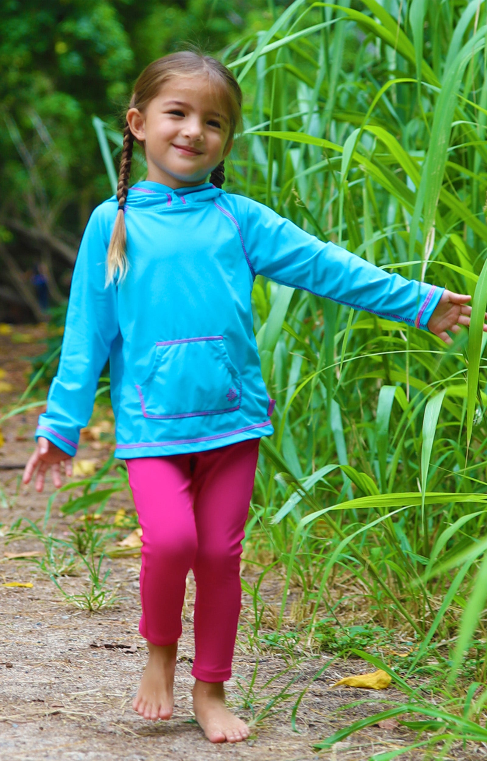 Little girl in UV Skinz's girl's pullover hoodie in aqua|aqua