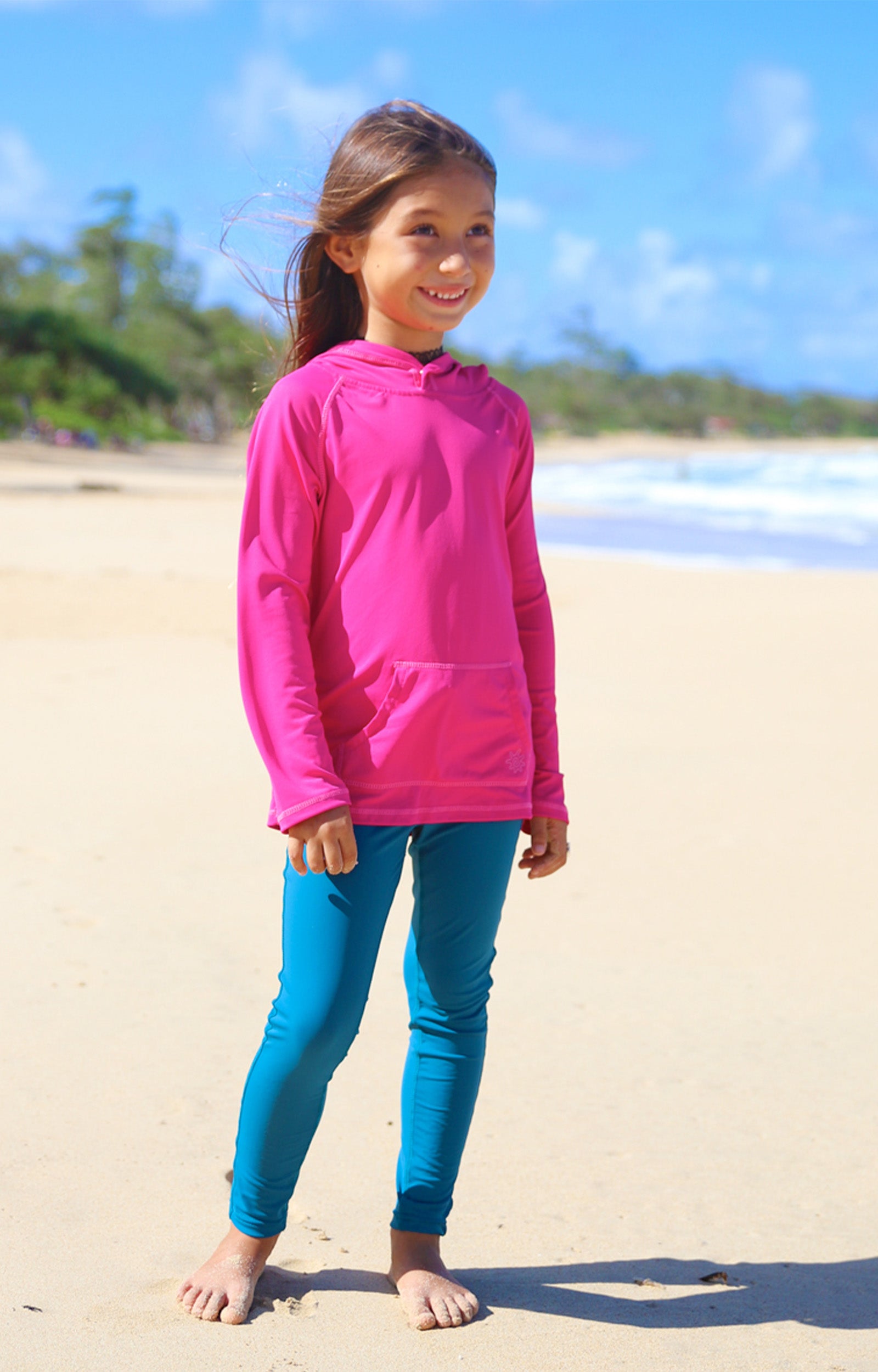 Little girl in UV Skinz's girls pullover hoodie in hot pink|hot-pink