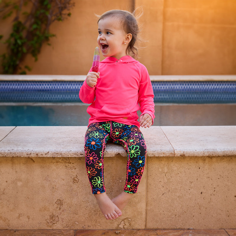 girl sitting by pool eating popsicle in pullover hoodie|neon-pink