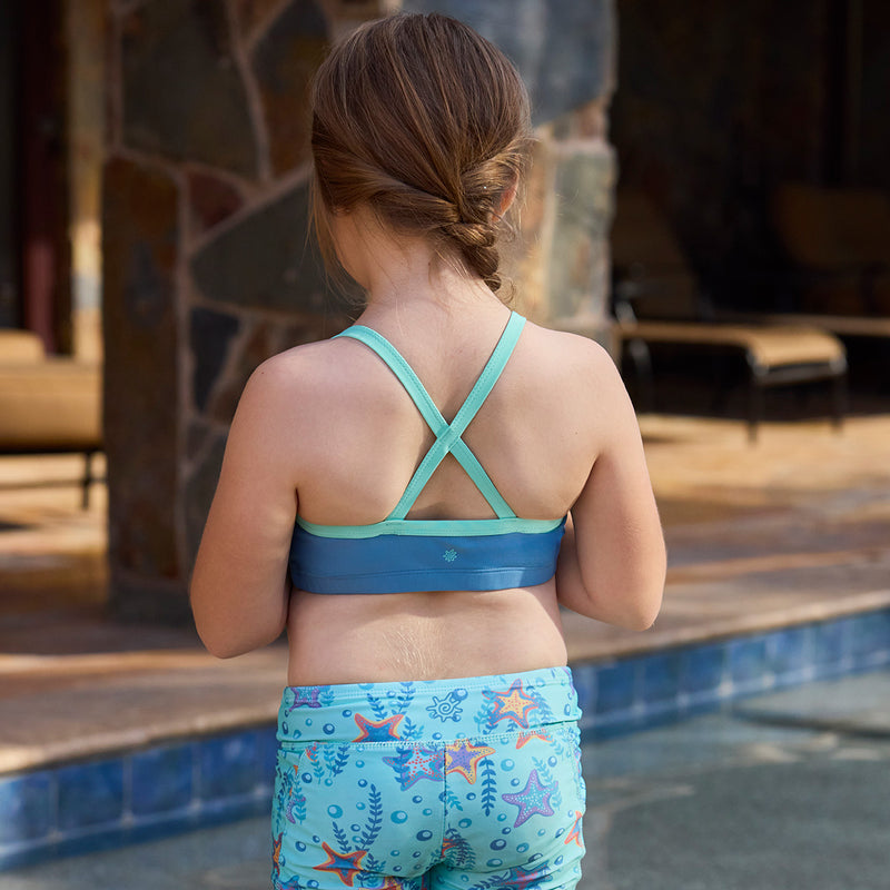 back of girl by pool in swim mate|baltic-seaglass