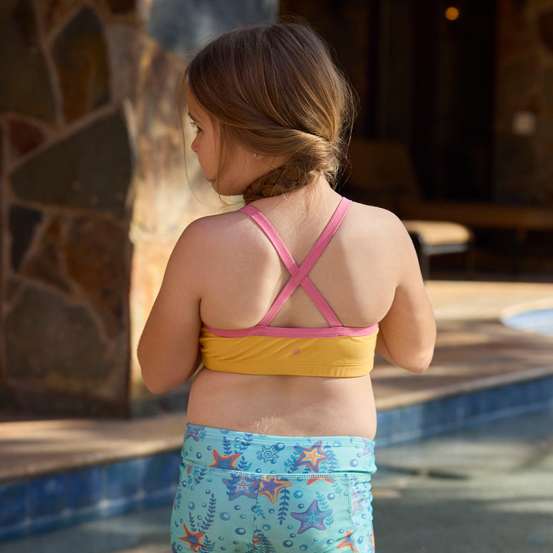 back of girl by pool in swim mate|marigold-wild-rose