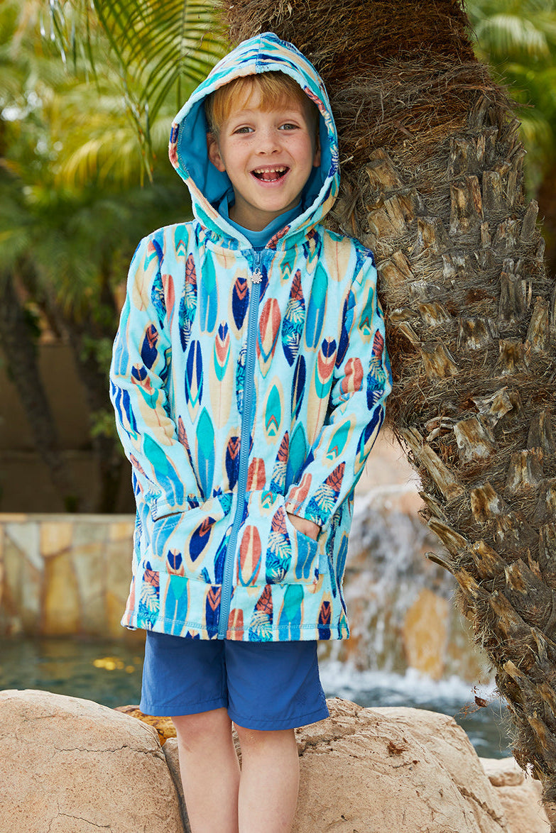 Young boy wearing UV Skinz's boy's hooded terry beach cover up in retro surf|retro-surf