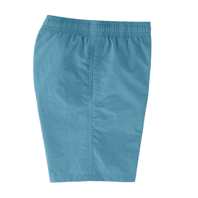 side view of the boys beach shorts in lagoon|lagoon