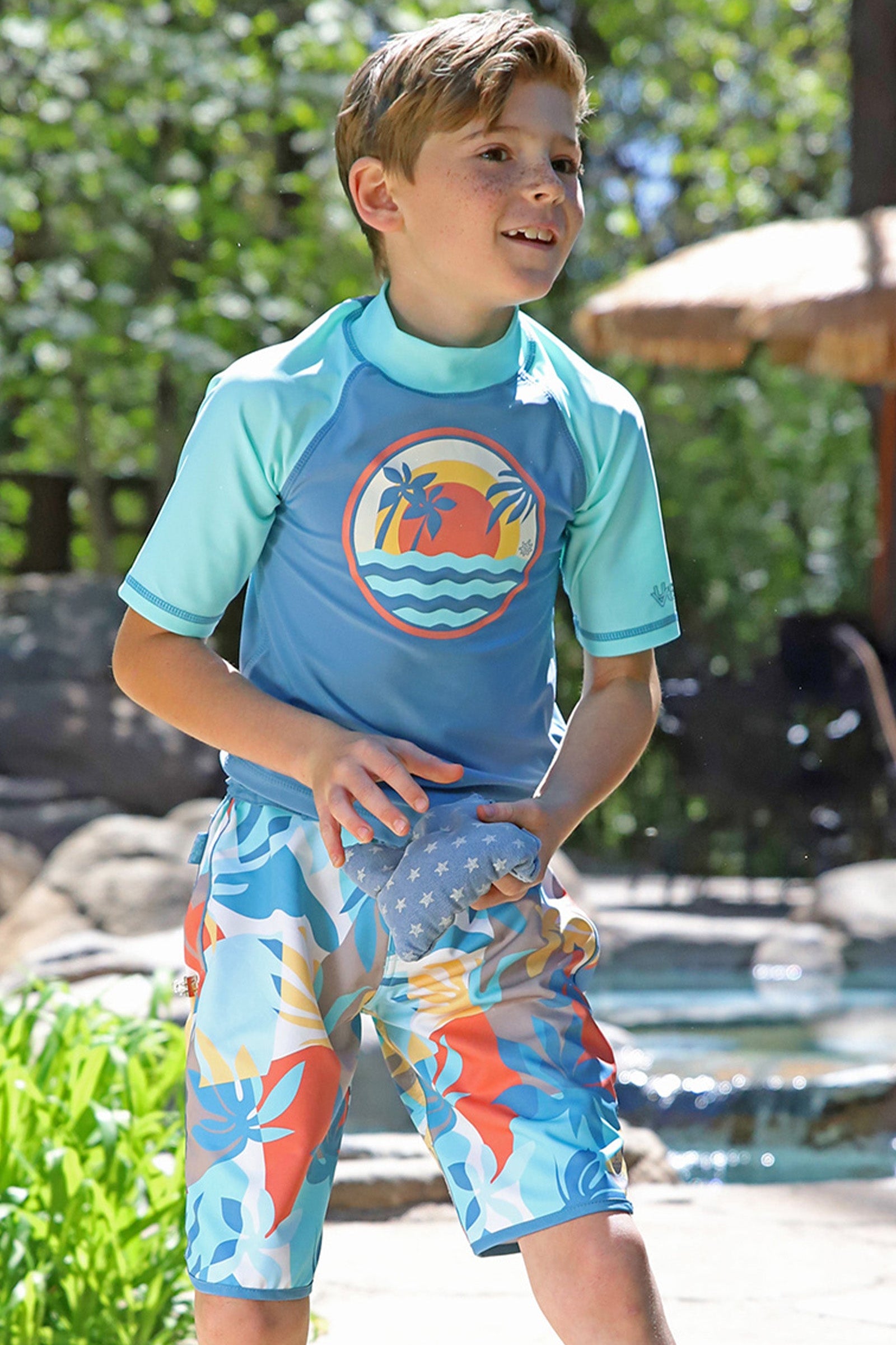 boy in retro board shorts|beach-picasso