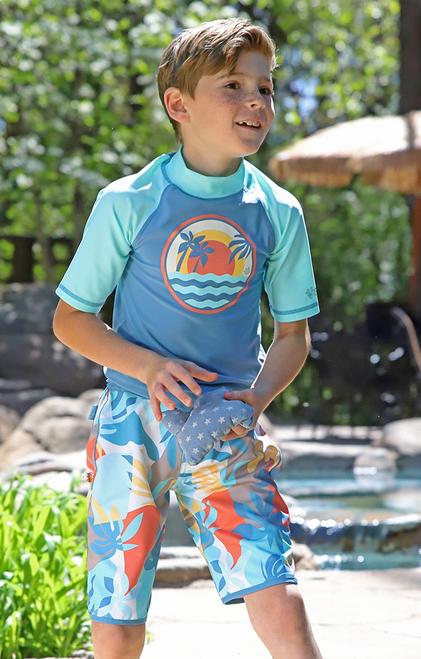 boy in retro board shorts|beach-picasso