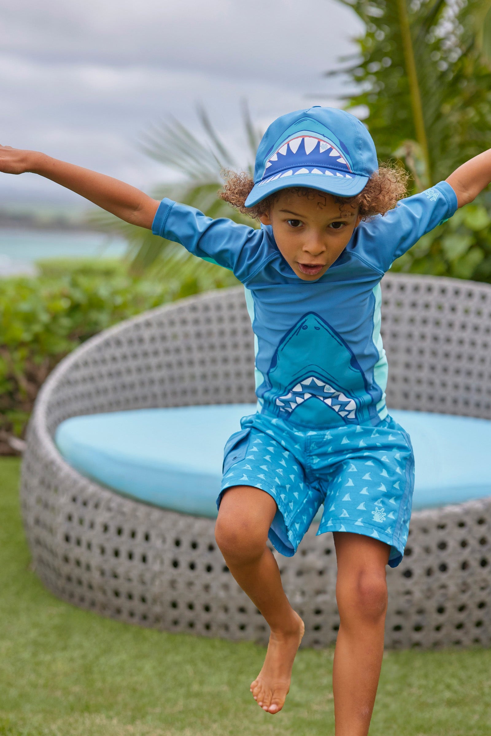 boy jumping in short sleeve adventure sun & swim shirt|shark-bite