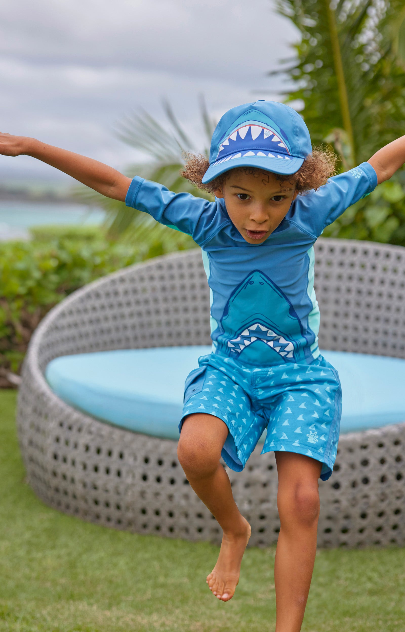 boy jumping in short sleeve adventure sun & swim shirt|shark-bite