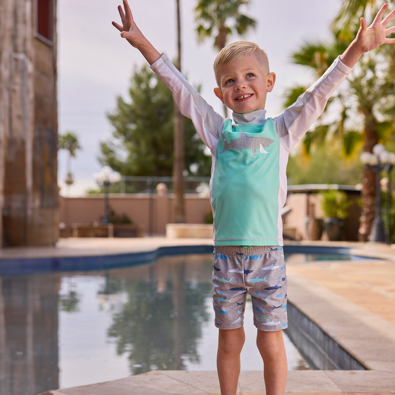 boy in swim and play jammerz by pool|vintage-sharks