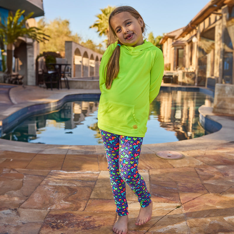girl standing by pool in pullover hoodie|neon-yellow