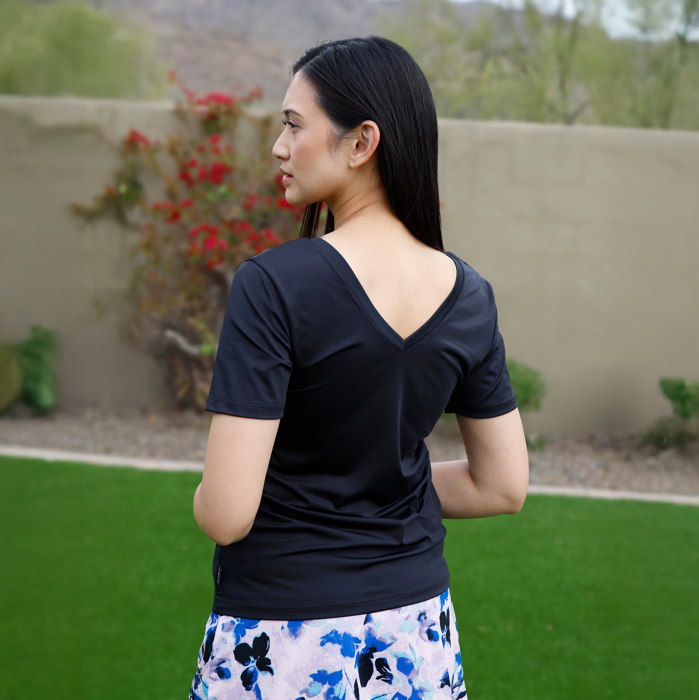 back v-neck view of womens short sleeve active reverse neck tee in black|black