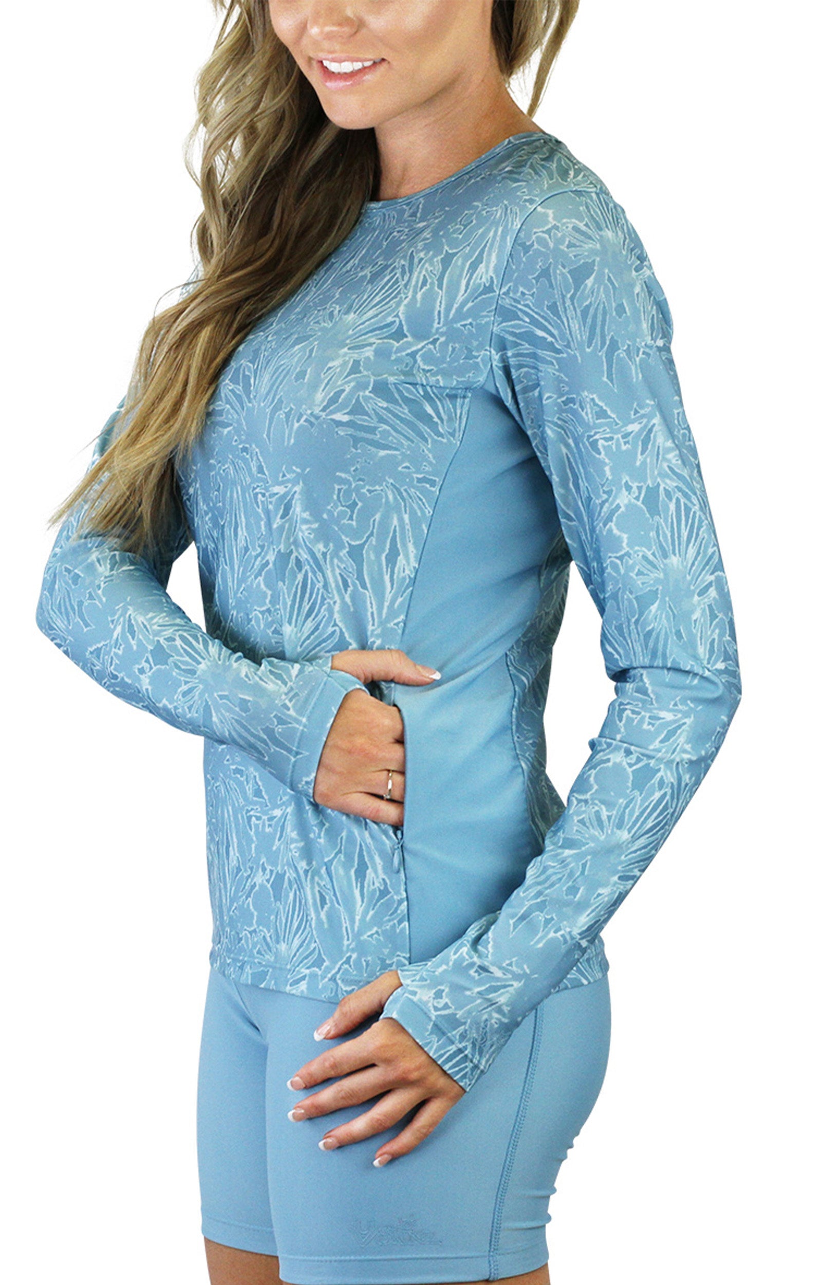side view of the women's long sleeve crew swim shirt in waterfall splash|waterfall-splash