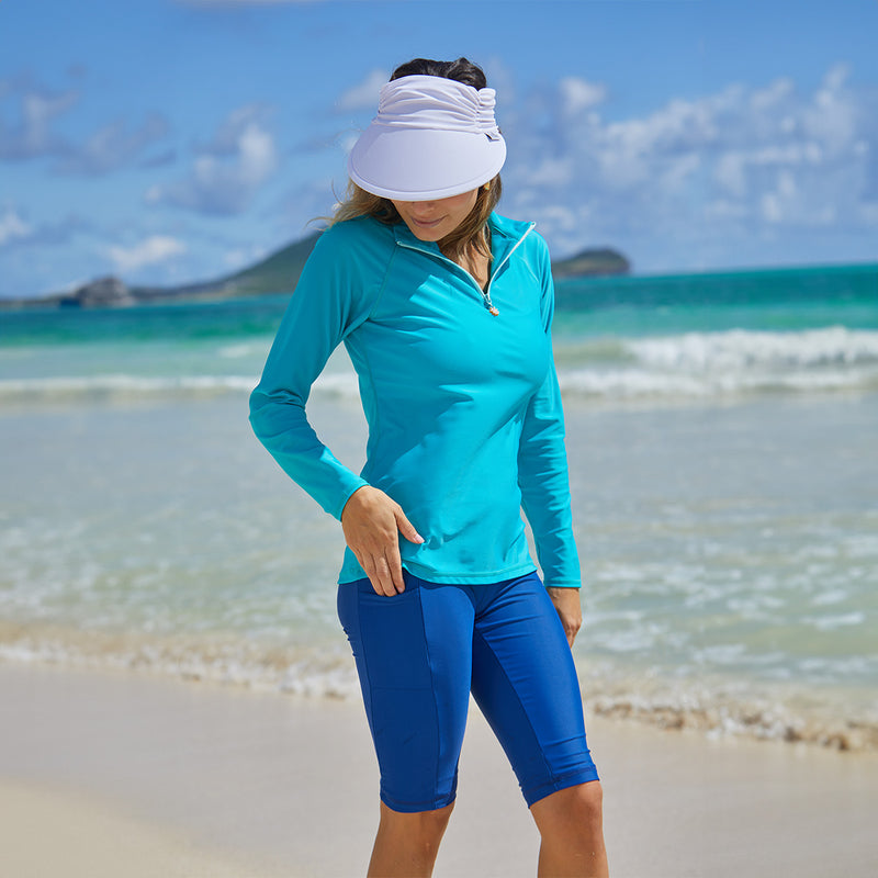 woman on the beach wearing her women's active swim jammerz in navy blue|navy-blue