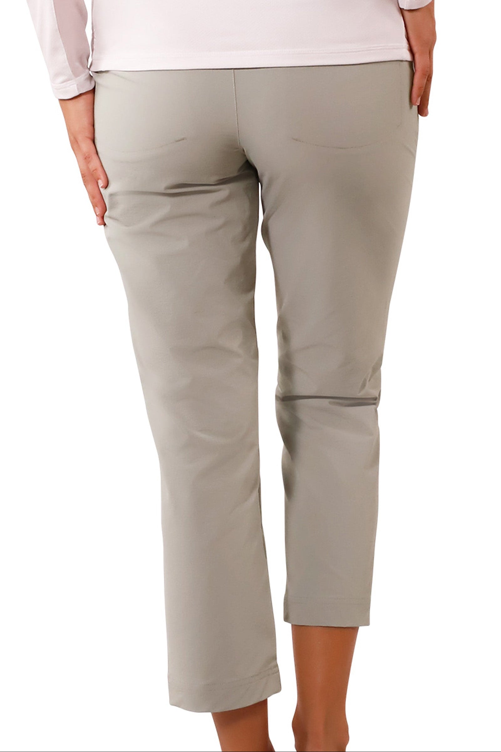 back view of woman in walking capris in agave|agave