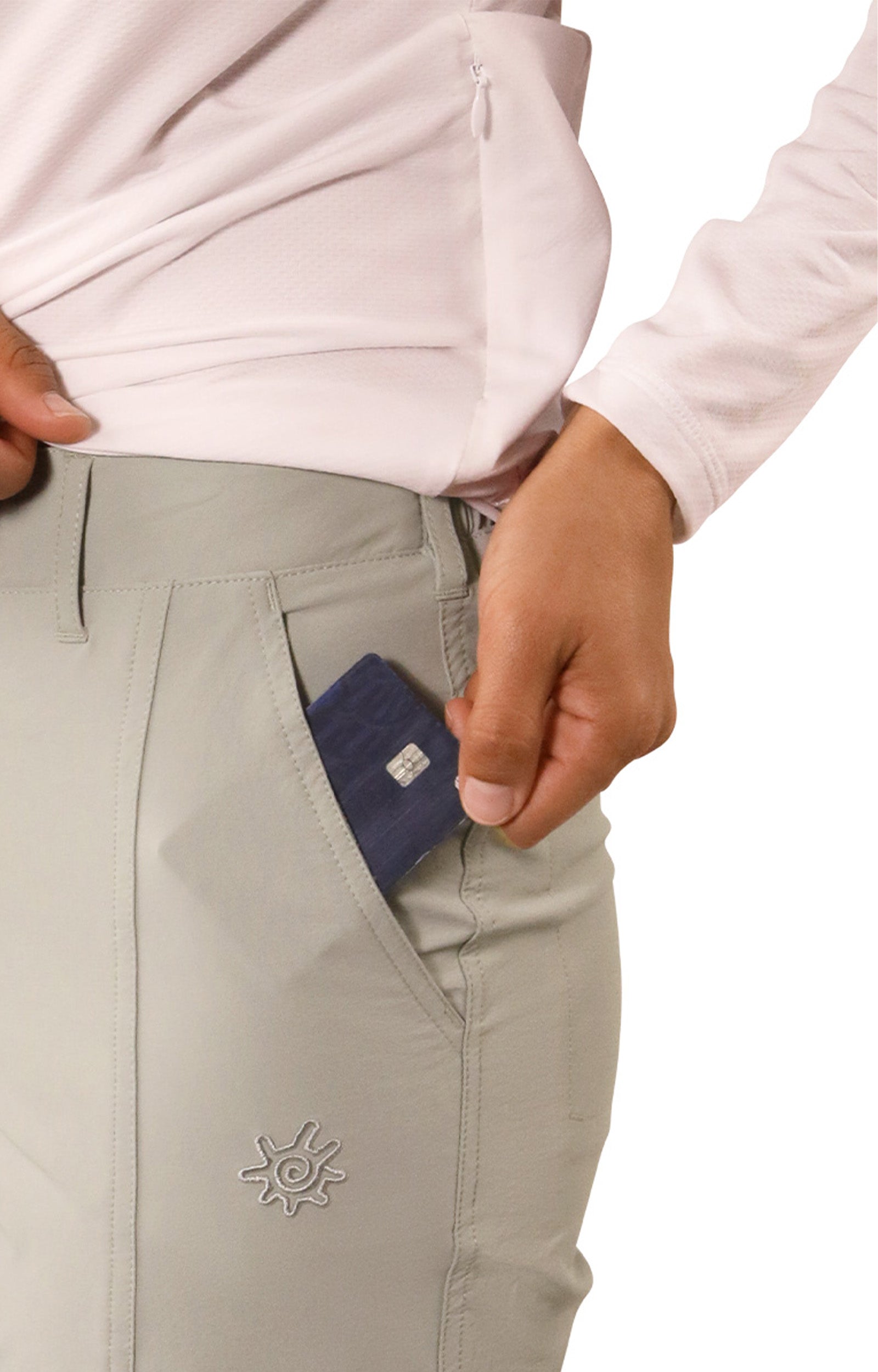 close up of pocket of woman in walking capris in agave|agave