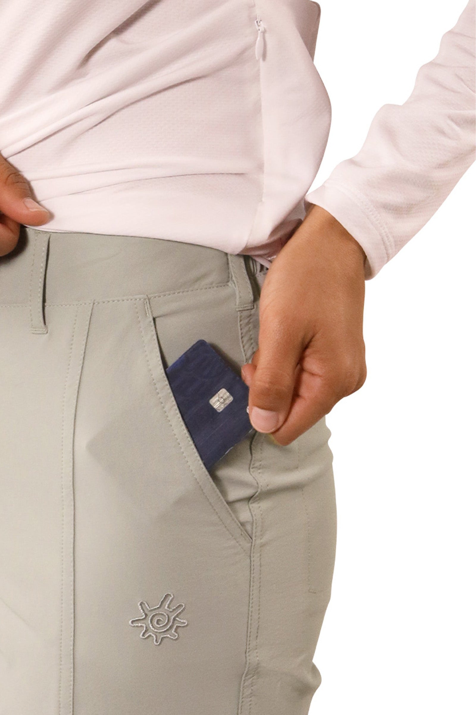 close up of pocket of woman in walking capris in agave|agave