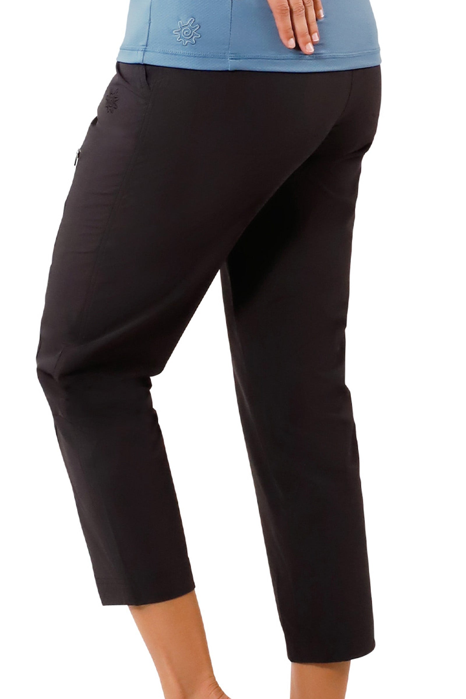 side view of woman in walking capris in black|black