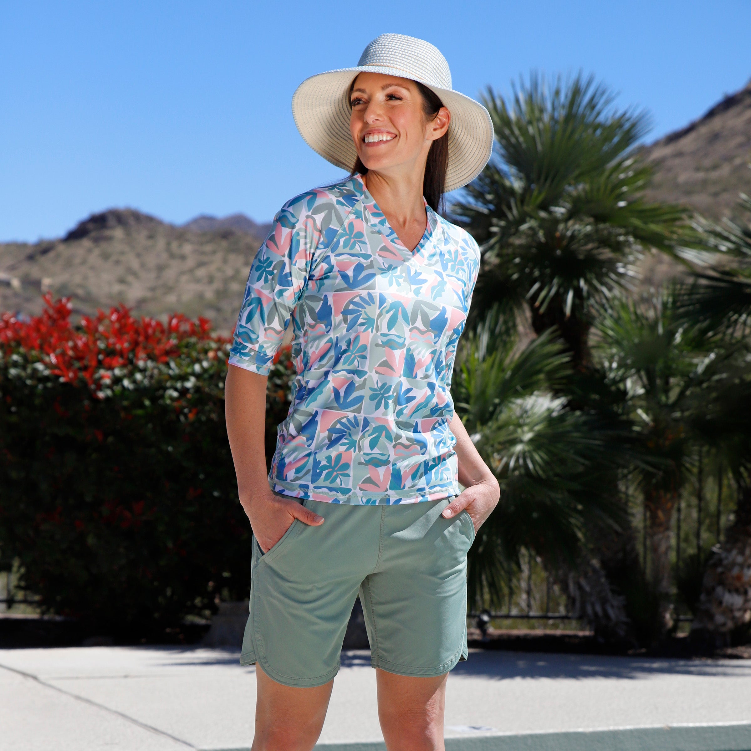 woman by the pool wearing womens v-neck sun and swim shirt|eden-reflection