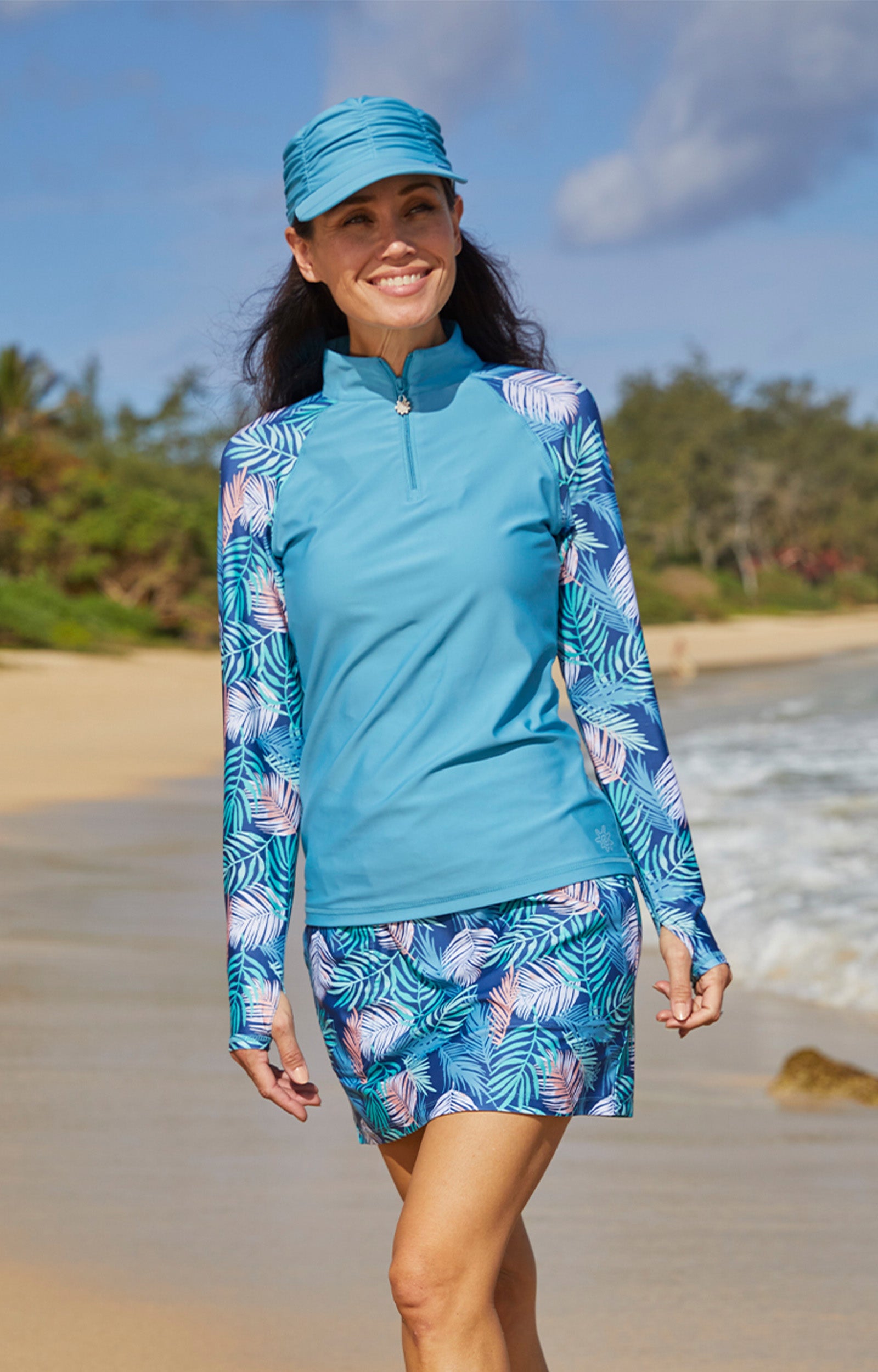 woman in women’s long sleeve quarter zip swim shirt|serene-waves