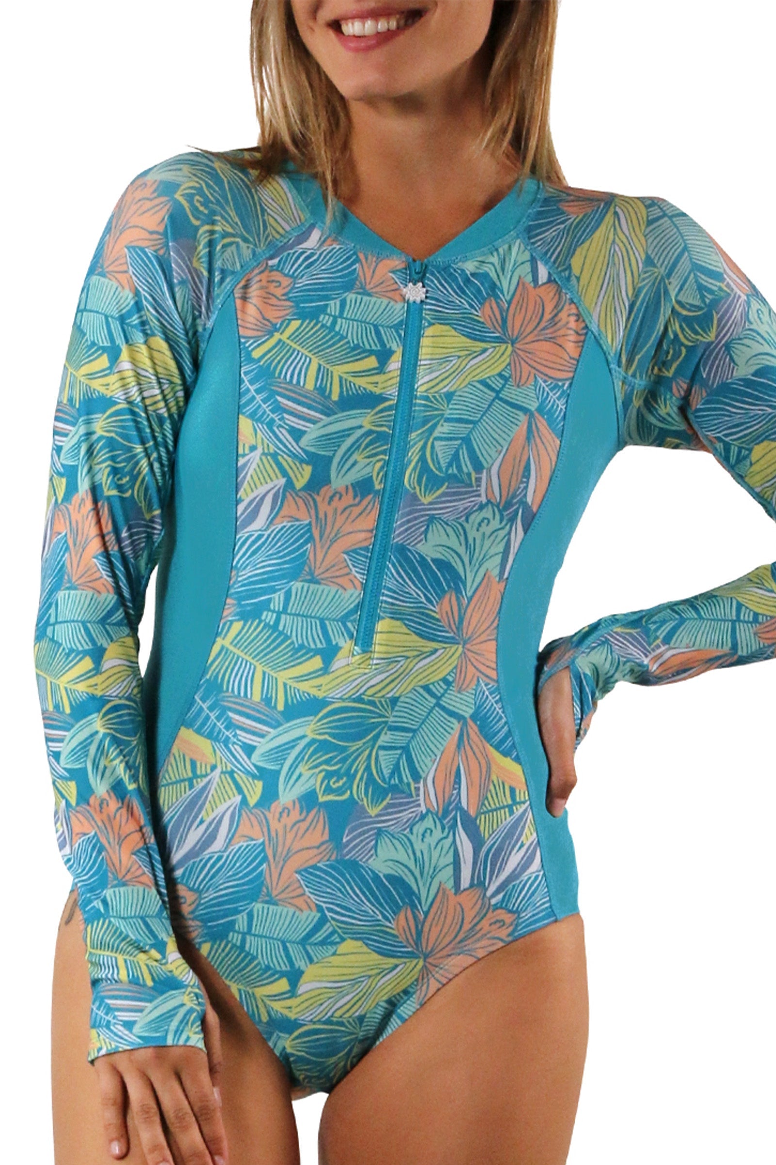woman on sand on beach in long sleeve half zip swimsuit|caribbean-tropics