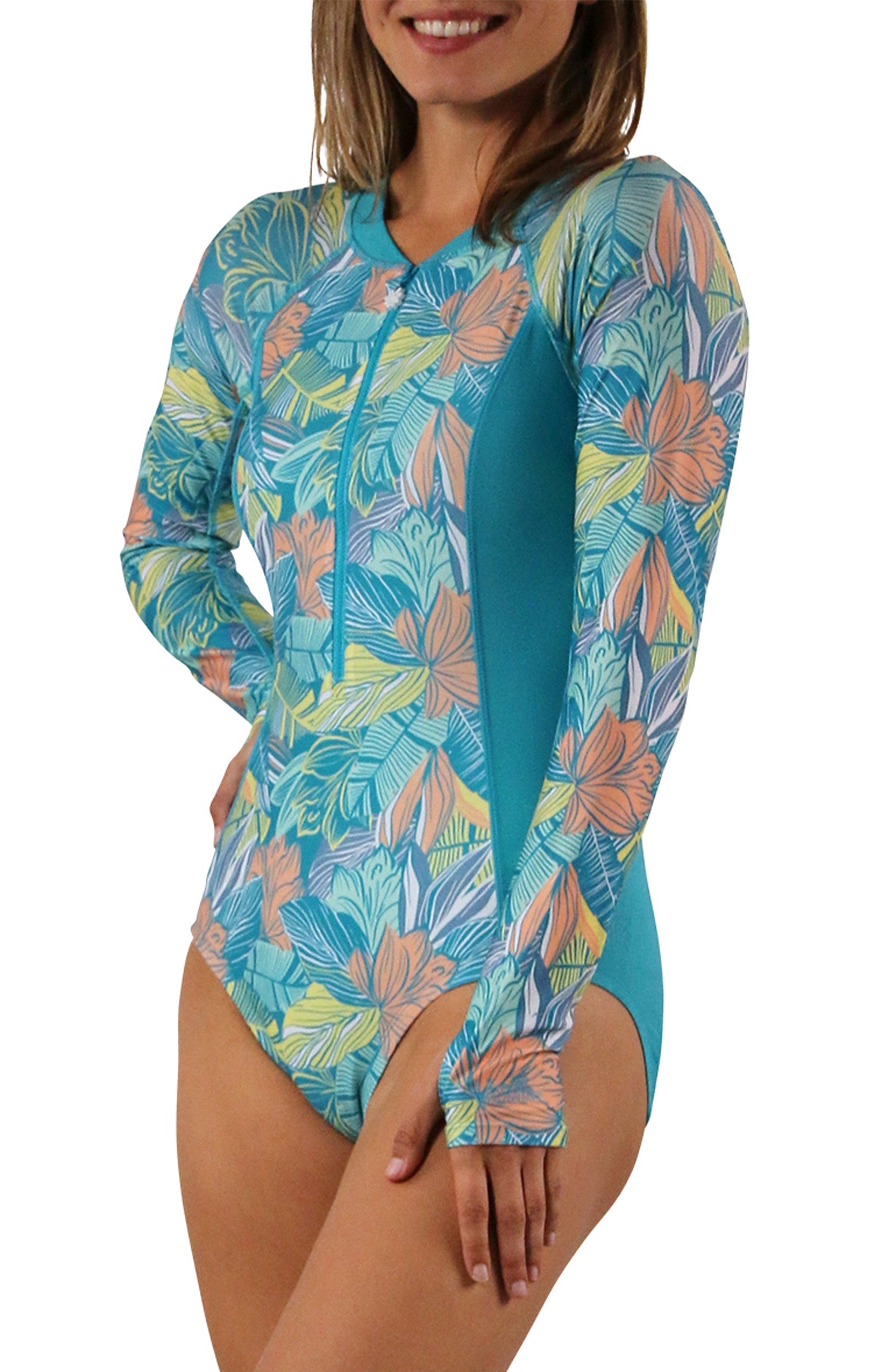 woman on sand on beach in long sleeve half zip swimsuit|caribbean-tropics