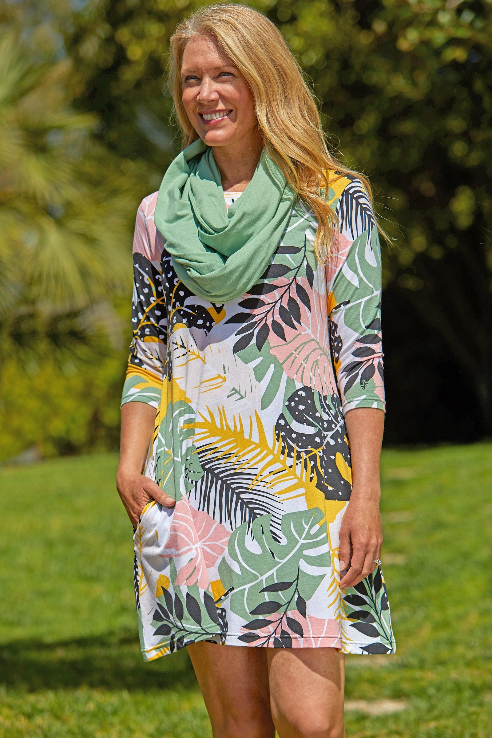 Woman in UV Skinz's Women's 3/4 Sleeve Swing Dress in Mykonos Blue|mykonos-blue