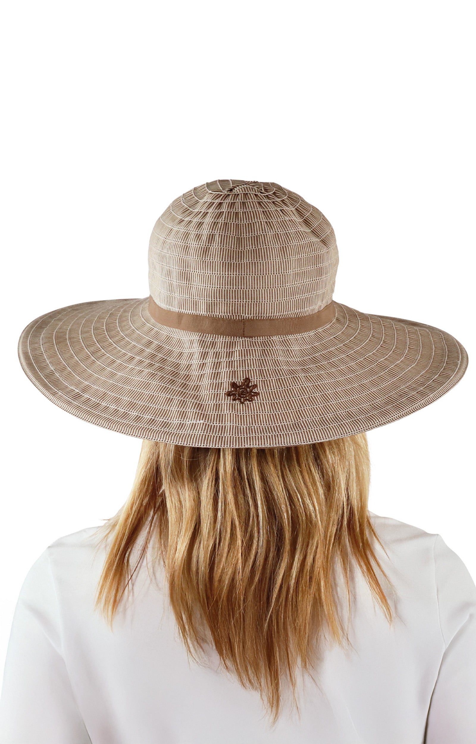 back view of woman in brown pacifica hat|brown