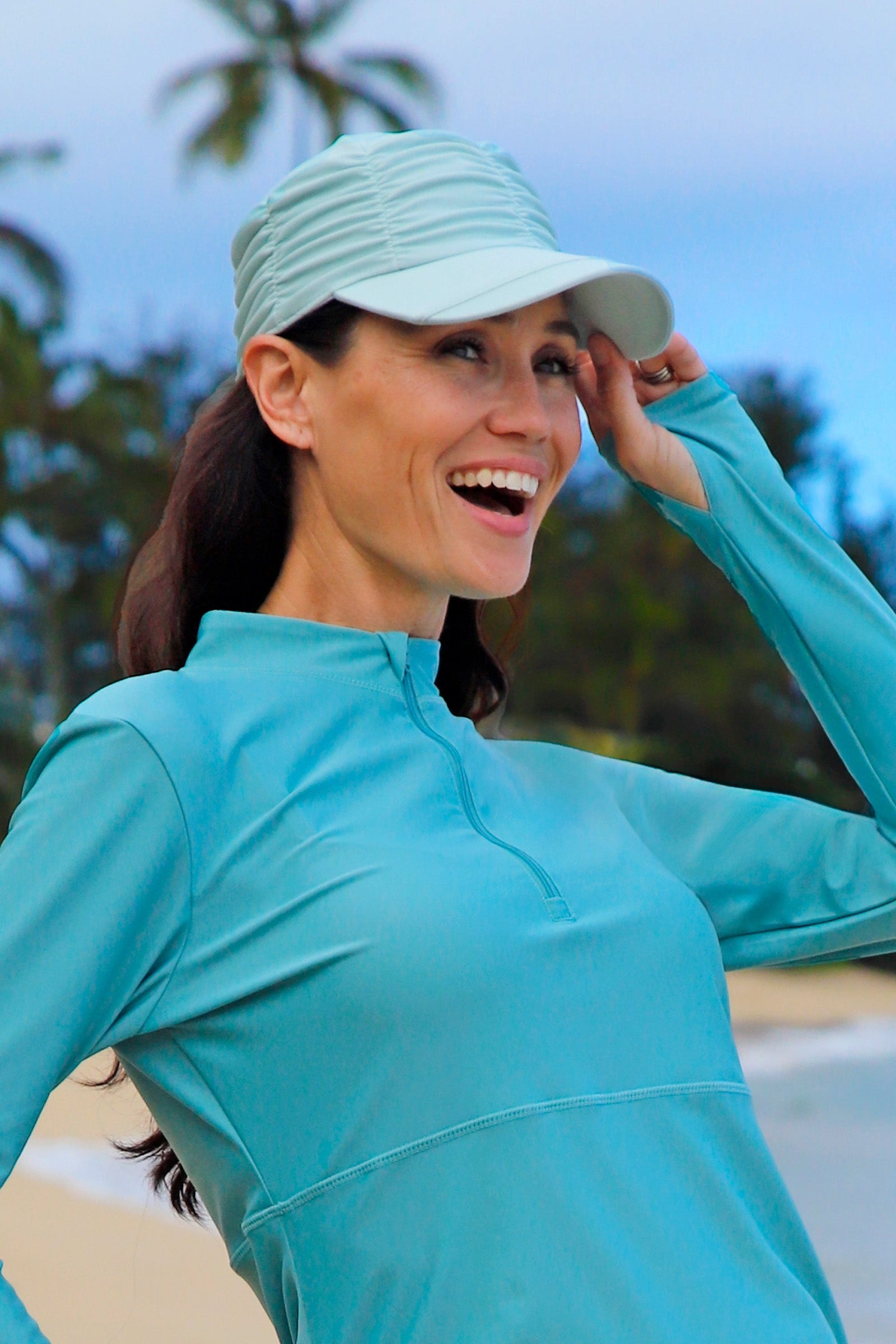 woman in ruched sun cap|dewdrop