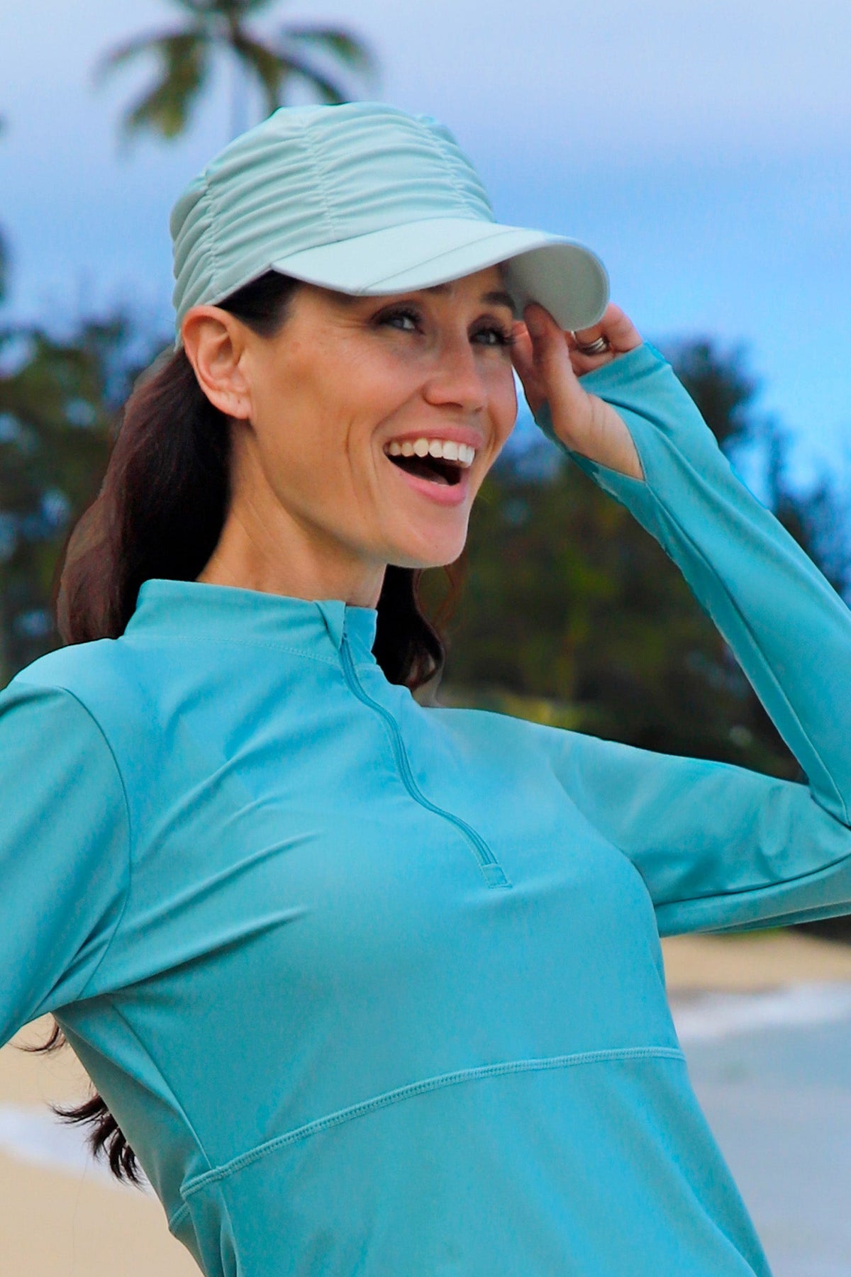 woman in ruched sun cap|dewdrop