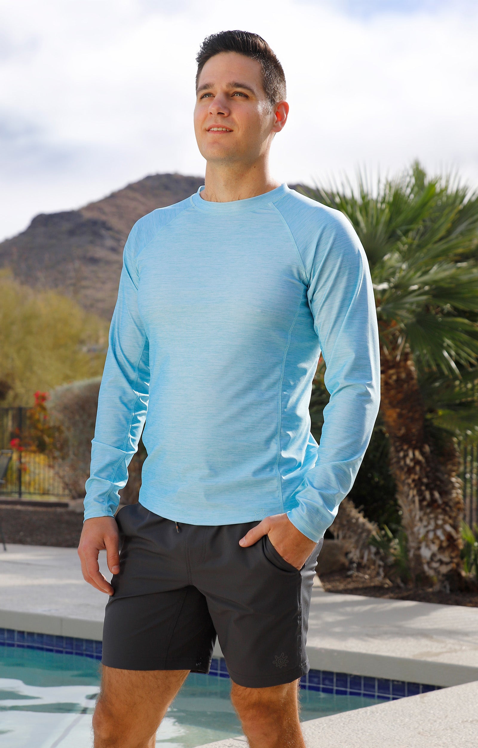 man by the pool wearing mens long sleeve crew sun & swim shirt|aquamarine-jaspe