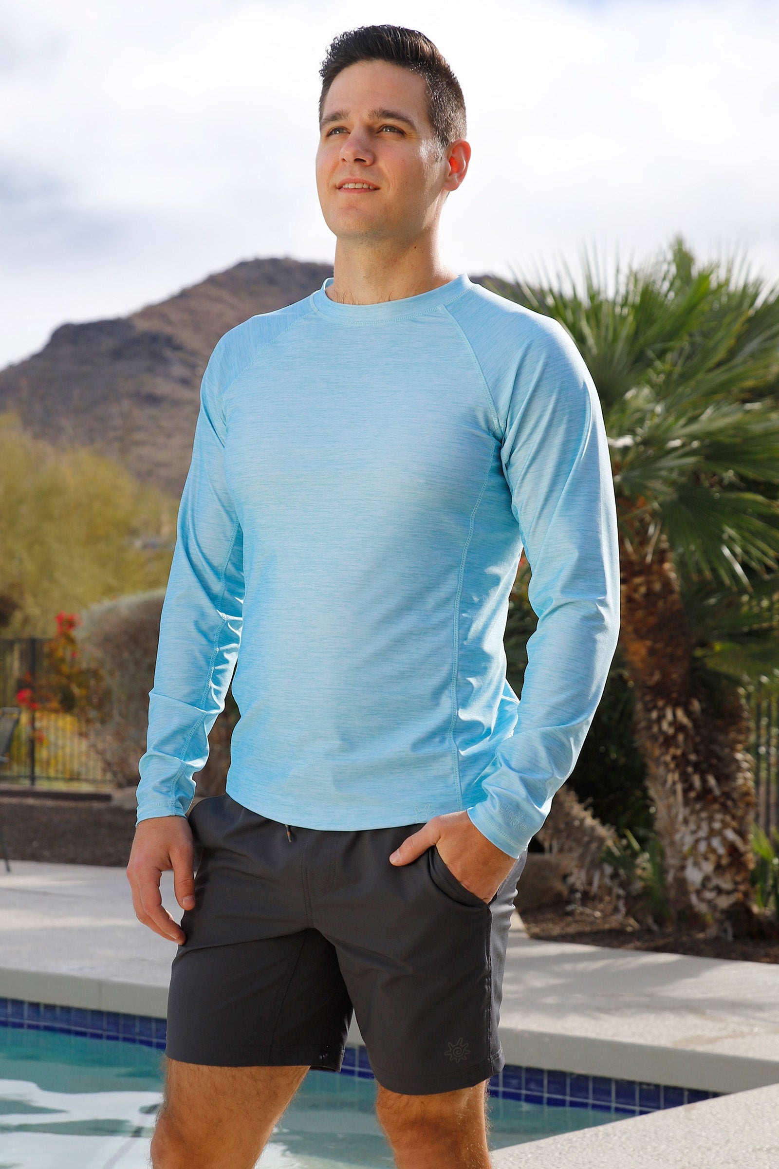 man by the pool wearing mens long sleeve crew sun & swim shirt|aquamarine-jaspe