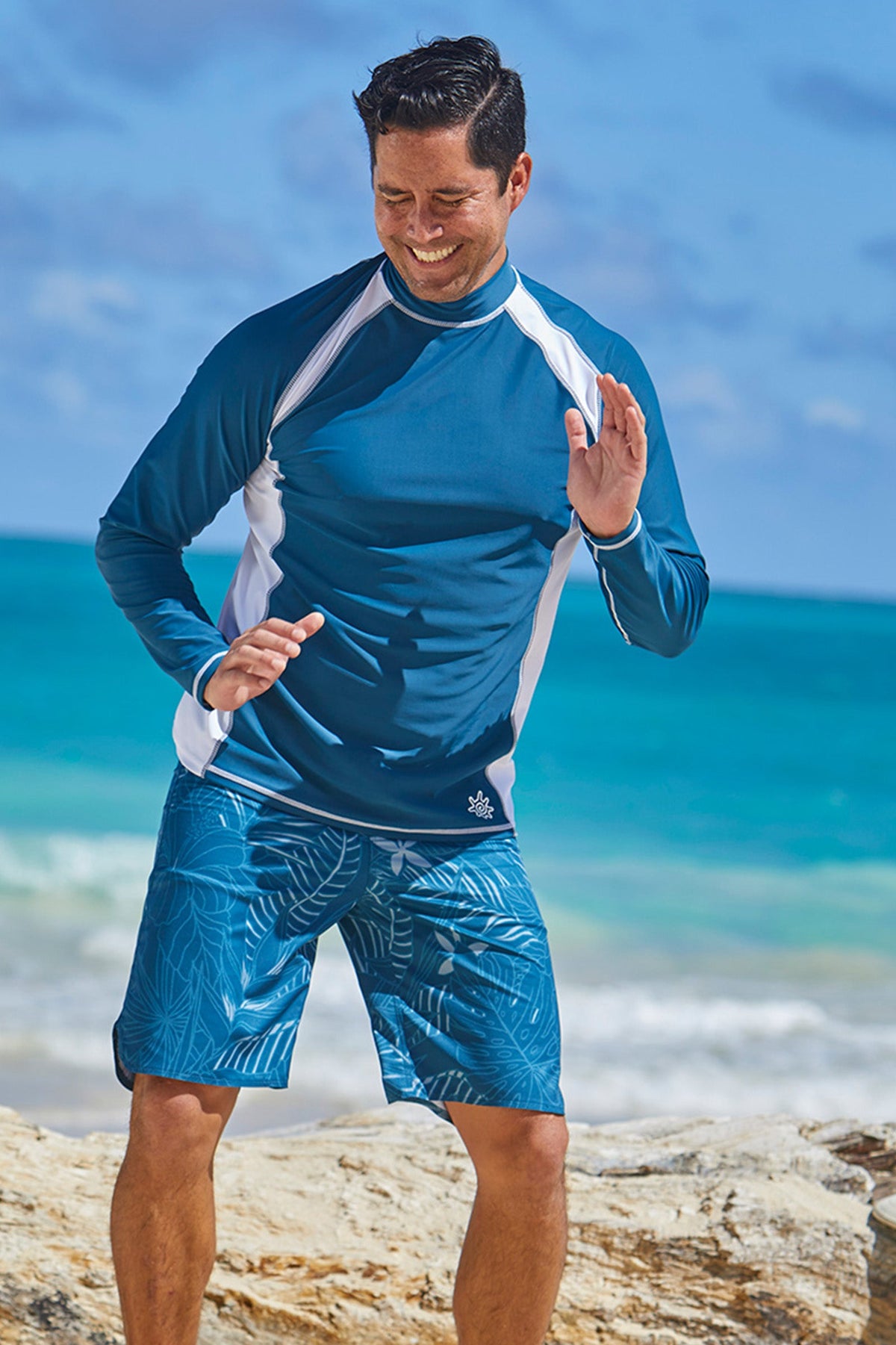 Man wearing UV Skinz's men's long sleeve active swim shirt in midnight white|midnight-white