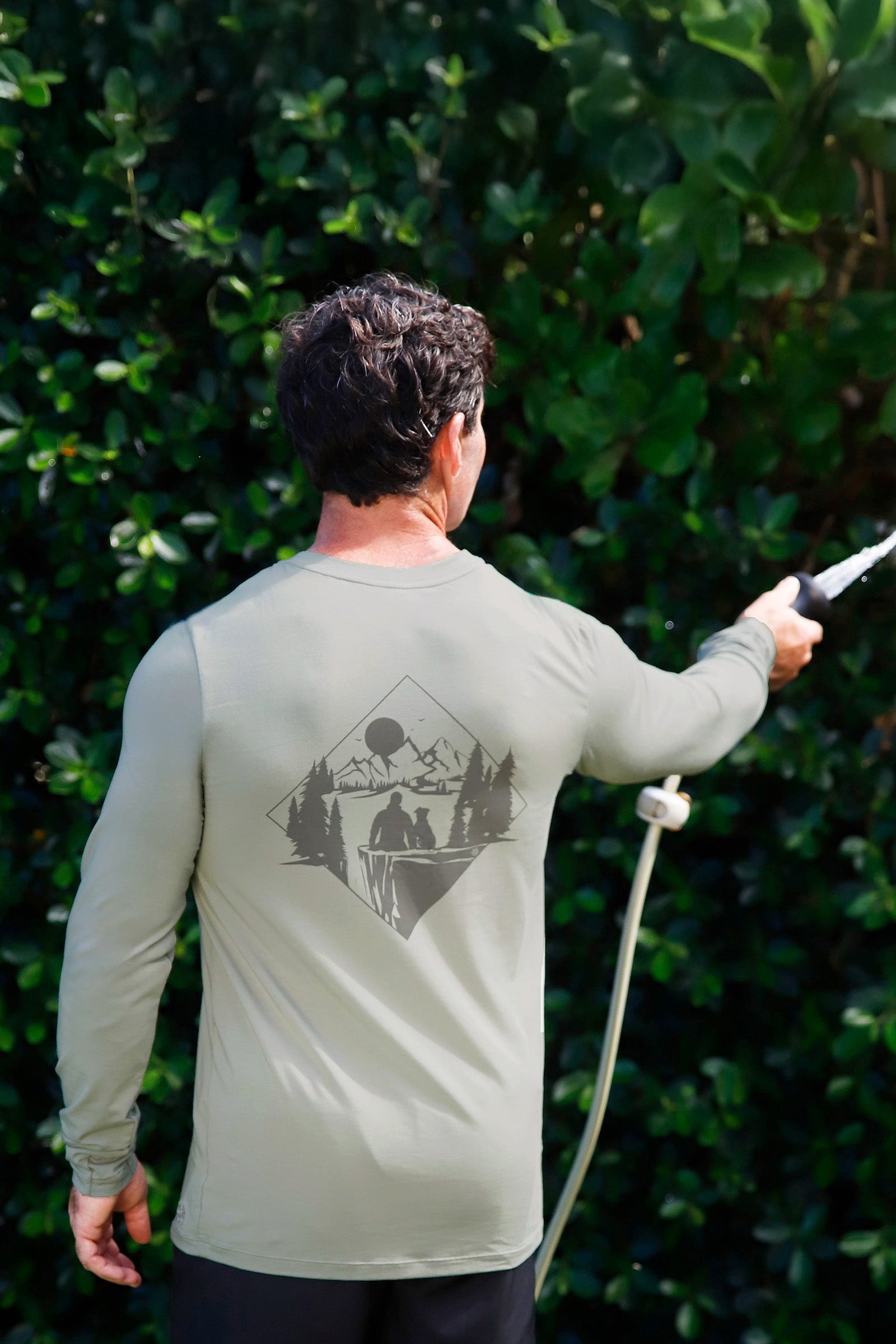 man watering his garden in men's long sleeve everyday tee|agave