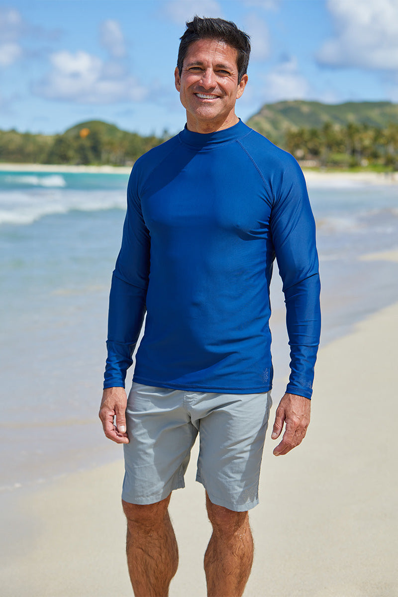 Man wearing UV Skinz's men's long sleeve swim shirt in dark navy|dark-navy