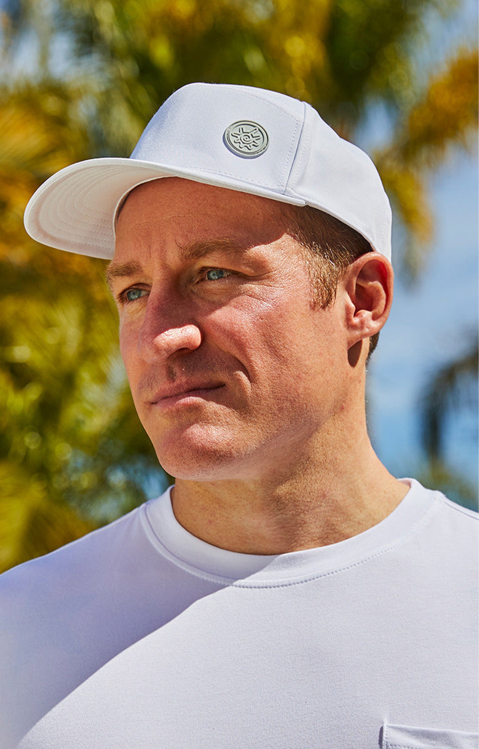 Man in UV Skinz's men's snapback hat in white|white