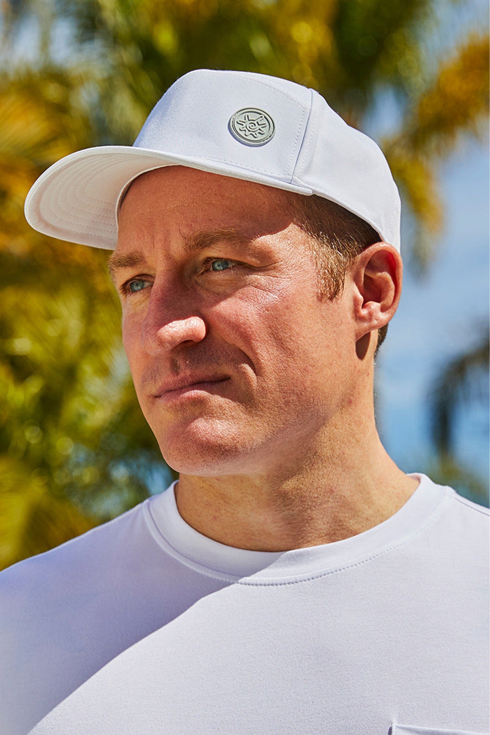 Man in UV Skinz's men's snapback hat in white|white