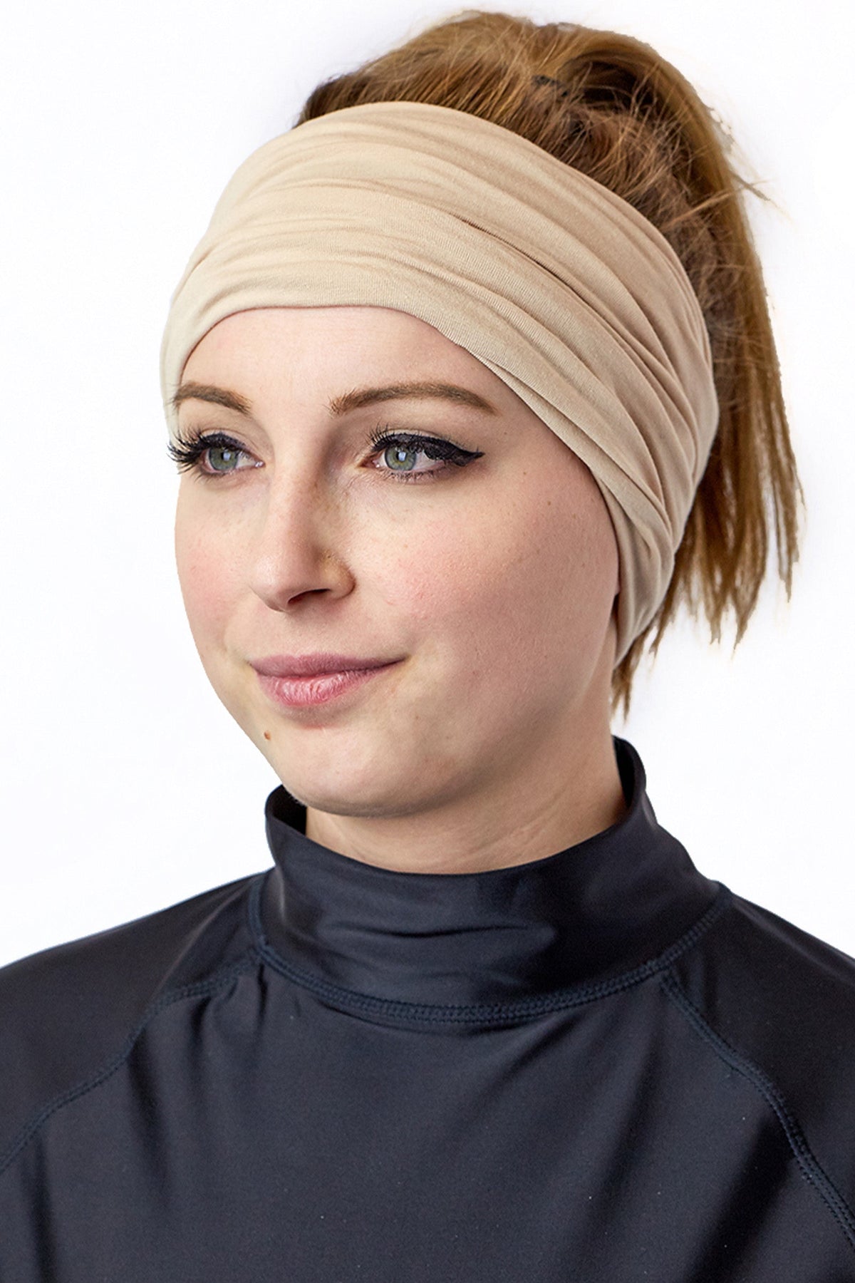 Woman Wearing UV Skinz's Bamboo UV Neck and Face Covering in Sand as a Headband|sand