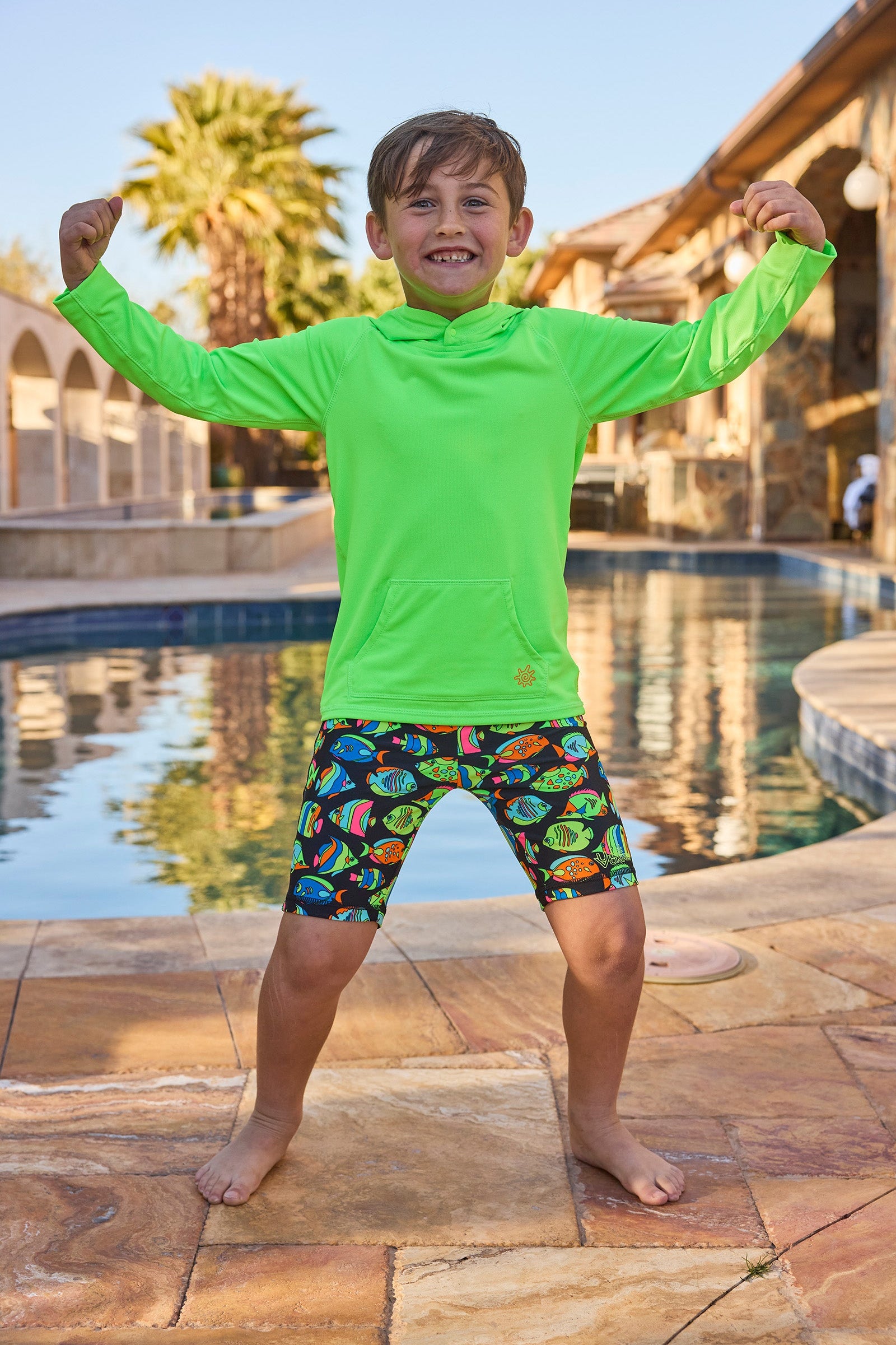 boy by pool in neon swim play jammerz|neon-fish