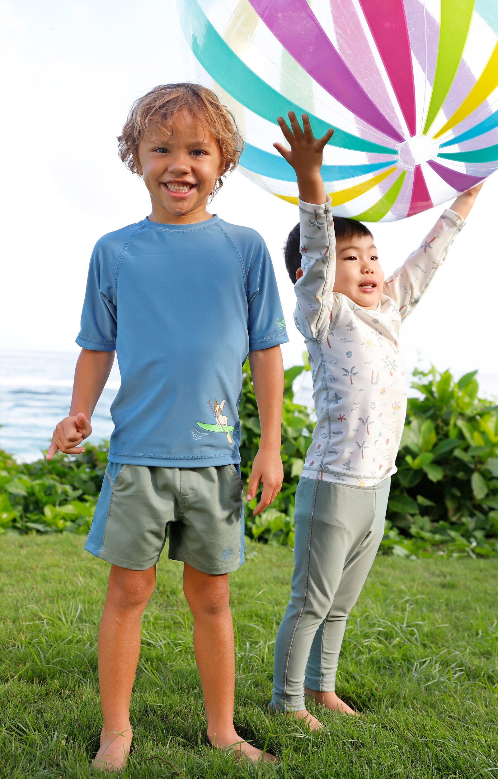 boy playing with friend in short sleeve crew sunny swim shirt in paddle board pup|paddle-board-pup