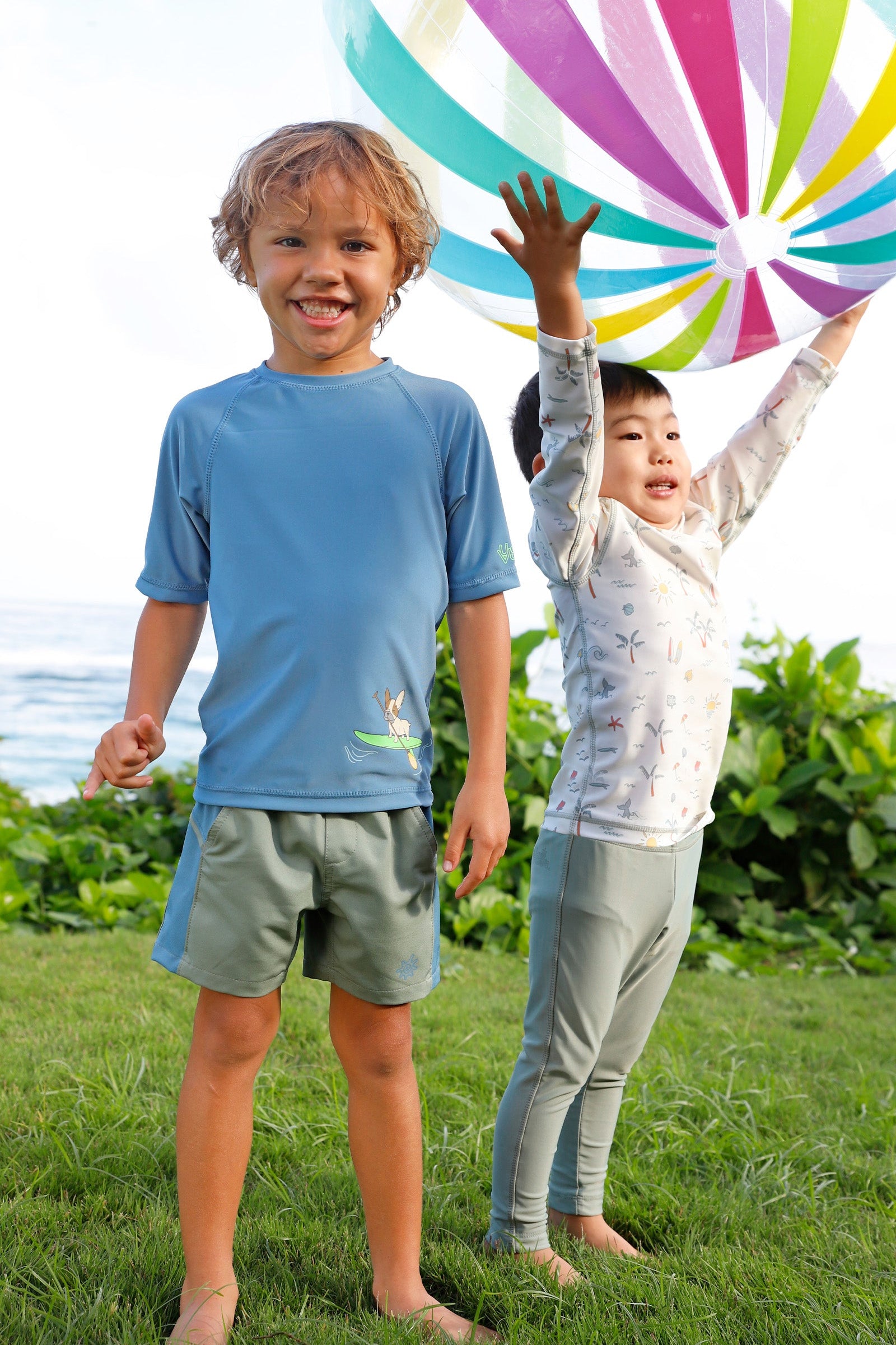 boy playing with friend in short sleeve crew sunny swim shirt in paddle board pup|paddle-board-pup