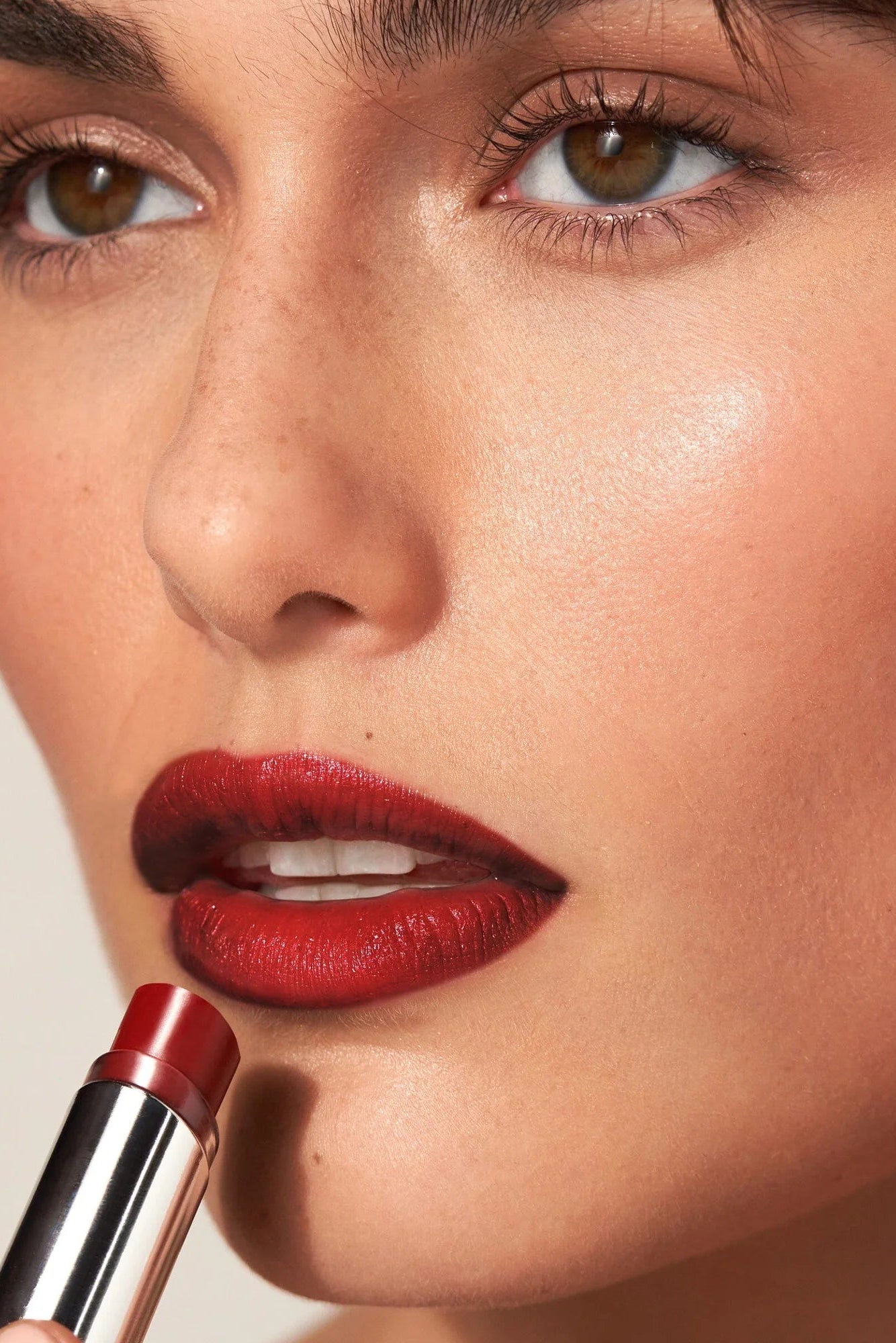 Woman wearing MDSolarSciences' lip balm in ruby|ruby