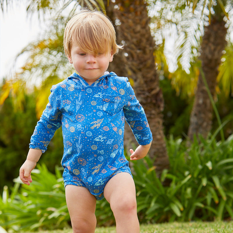 Baby Boy Walking Near the Beach in the Baby Boy's Hooded Sunzie in Space Pups|space-pups