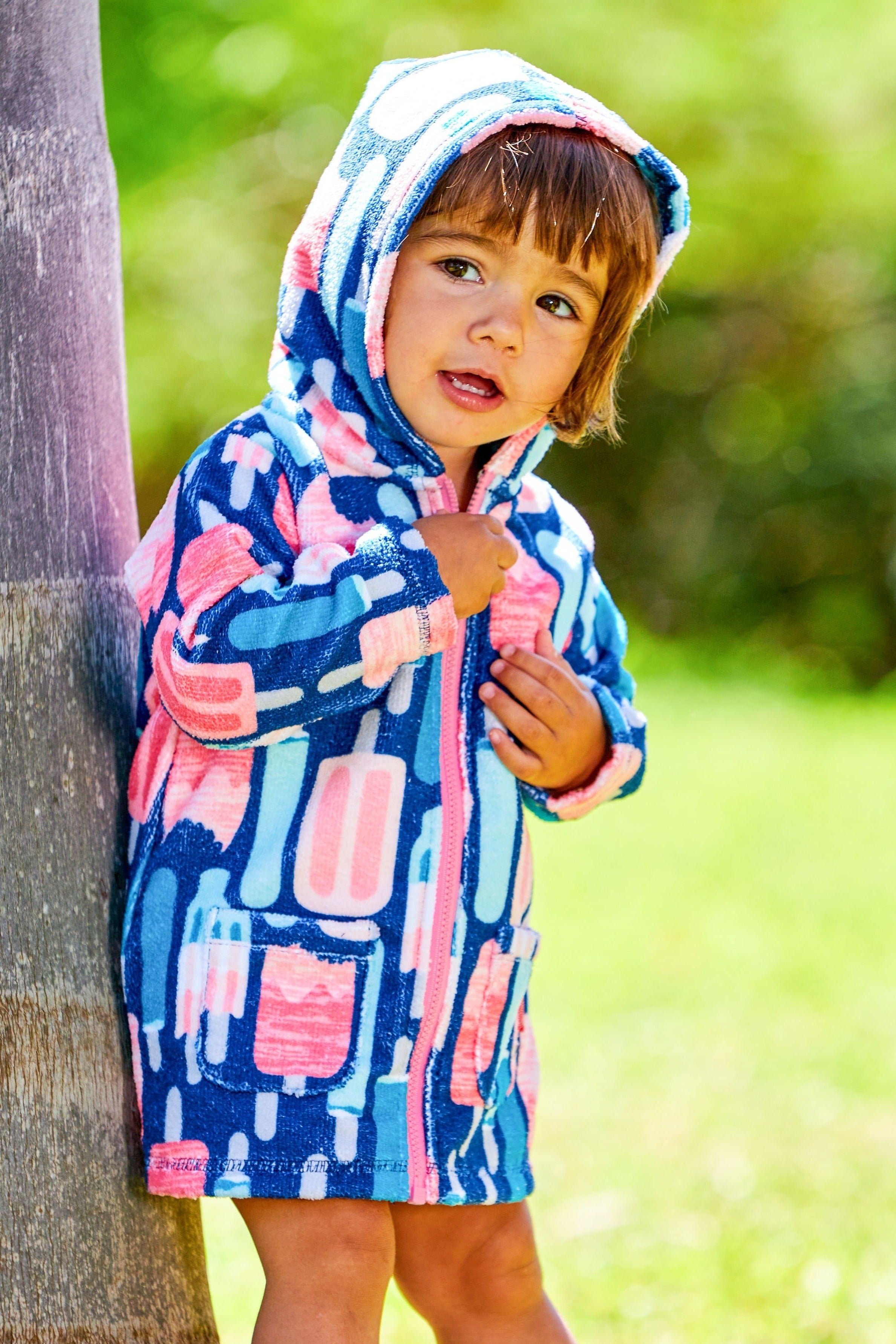 Little girl in the Baby Girl's Hooded Terry Beach Cover-Up in Popsicles|popsicles
