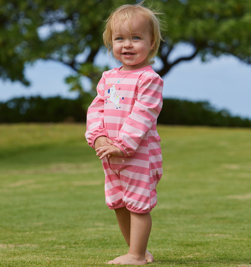 Little baby girl in the baby girl's one-piece swimsuit in pink zebra stripe|pink-zebra-stripe