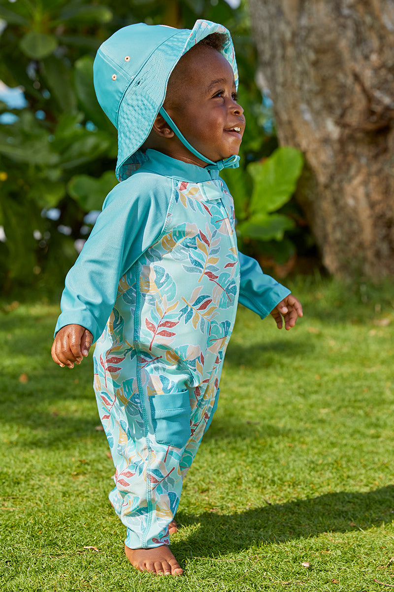 baby boy in the baby boy's long-sleeve swimsuit in tropical cascade|tropical-cascade