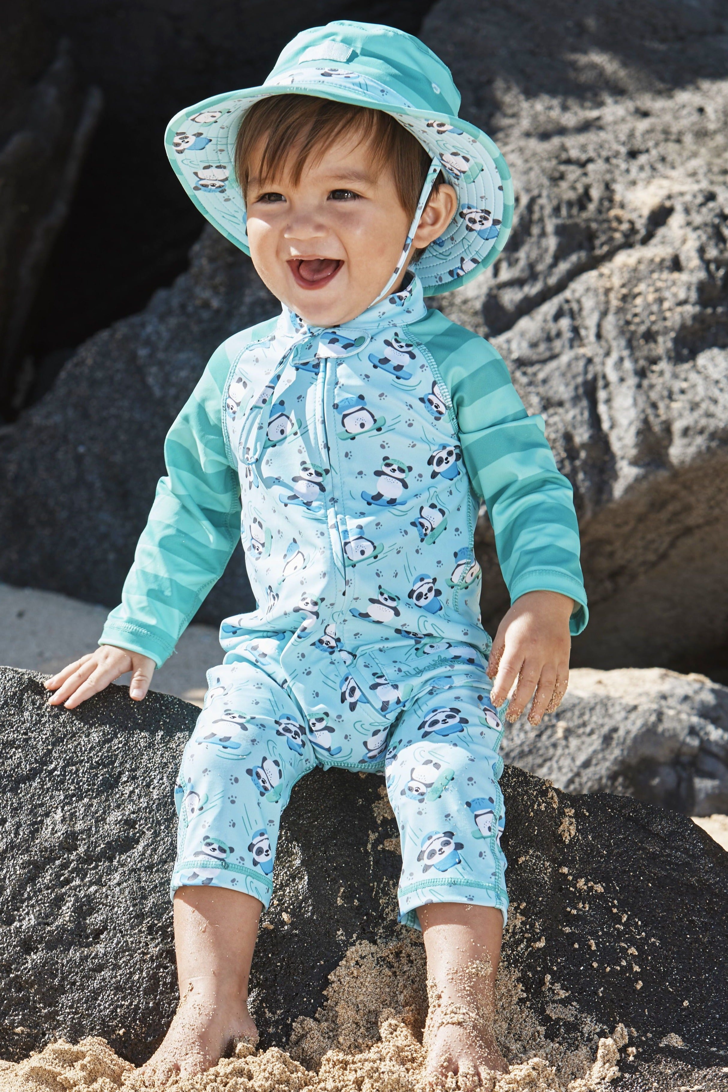 Little boy in UV Skinz'z baby boy's one-piece swimsuit in playful panda|playful-panda