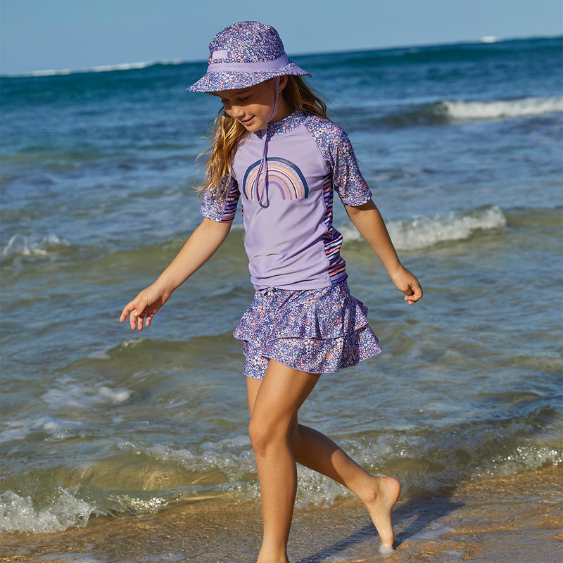 Girl wearing UV Skinz's girls swim skirt in lavender fields|lavender-fields