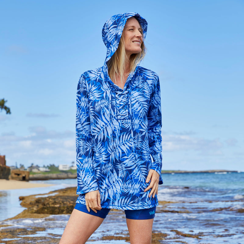 Woman on the Beach in the Women's Hooded Beach Cover Up in Navy Blue Palms|navy-blue-palms